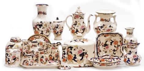 A group of Masons ironstone Mandalay pattern part wares, to include a cheese dome and cover, two large vases, ginger jar and cover, graduated jug set, candlesticks, serving plates, etc. (2 trays and a quantity)