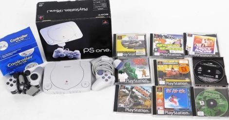 A Playstation One console, controller and various games.