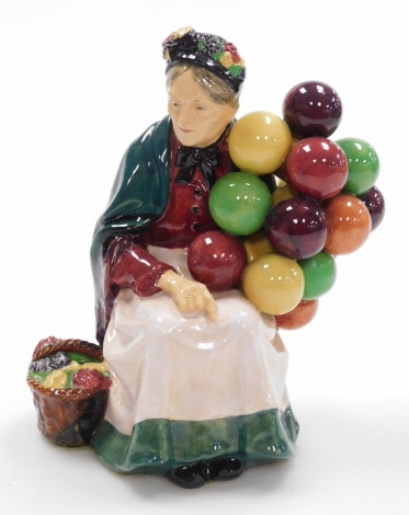 A Royal Doulton Old Balloon Seller figure, numbered HN1315, with applied velvet bottom, 19.5cm high.