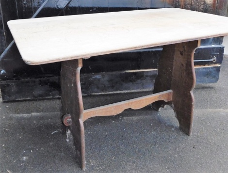 A light oak refectory table, 75cm high, 130cm wide, 78cm deep.