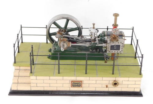 A Stuart Turner No 9 steam engine, scratch built, on a naturalistic fenced and bricked rectangular base, model 28cm wide.