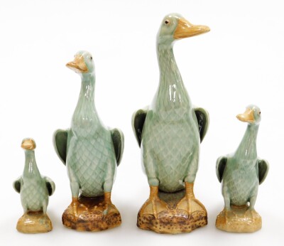 A set of four graduated Chinese celadon glazed models of ducks, each on a rock base with Chinese impressed mark to underside, 25cm, 21cm, 16cm and 11cm. (4)