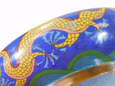 An early 20thC Chinese cloisonne bowl, of circular form, decorated with front facing dragon in yellow, green and red on a blue ground, the reverse with four character Ming mark, 26cm diameter. - 7