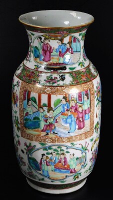 A 19thC Cantonese famille rose vase, with compressed trumpet neck and shouldered circular body, decorated with panels of figures in interior and exterior settings, among further figures, butterflies and flowers, predominately in pink, green and blue, 36cm