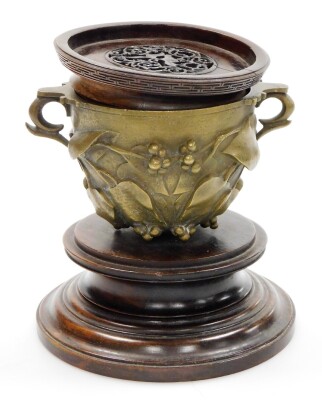 A Chinese bronze two handled cup, cast with leaves, berries, etc., mounted on a turned mahogany plinth, with a wooden lid, 15cm high overall. - 3