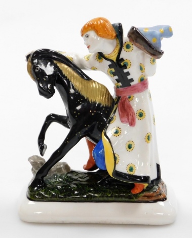 A Russian porcelain figure, of Ivan The Fool and Humped Back Horse, a Soviet porcelain F16 State Factory, Petorgrad 1922 modelled by Ivan Kuznetsov after A Tale By P.Ershova, depicted in a traditional patterned kaftan, bears signature and date and number 