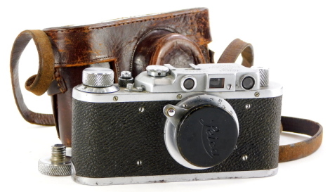 A Russian type Leica IIIa camera, serial number 357642, with a Leitz 5cm f3.5 Elmar lens, in a leather case.