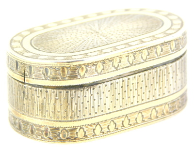 A George III silver and silver gilt rectangular nutmeg grater, with rounded corners and engine turned decoration, the hinged lid enclosing a pierced and hinged grill, London 1794, makers mark indistinct, 4cm wide. Auctioneer Announcement: We believe this