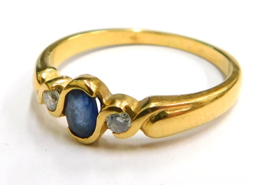 An 18ct gold sapphire and diamond ring, the central oval sapphire, on tube twist setting, with two tiny diamonds to each side, ring size O½, 3.3g all in, boxed.