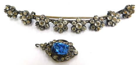 Two items of stone set jewellery, to include a crescent shaped brooch, set with eight floral cluster groups, each with paste stones, in a silvered gilt setting, but heavily worn, 10cm wide, and a part earring, in a similar style set with white paste stone