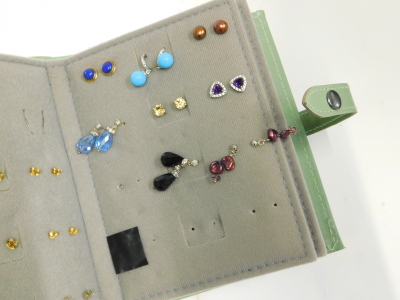 A quantity of mainly costume earrings, to include lapis, cut glass, fresh water pearls, and various simulated stones, contained in a Little Books of Earrings holder. - 3