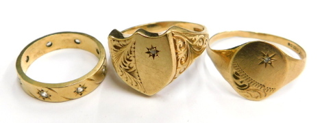 Three 9ct gold dress rings, to include a 9ct gold shield shaped dress ring, with scroll and carved sides and a tiny set panel, ring size T, another with oval panel and tiny set white stone, ring size U½, and an eternity ring set with tiny diamonds, ring s