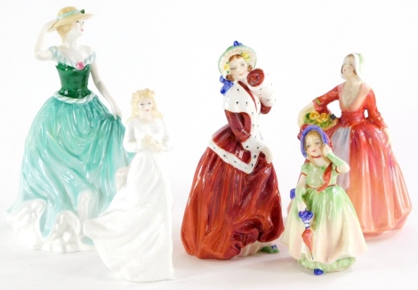 A collection of Royal Doulton porcelain figurines, Emily, Janet, Babie, Loving You and Christmas Morn.