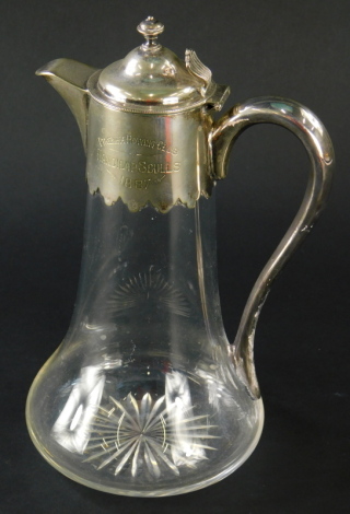 A Victorian presentation glass claret jug, with silver plated mounts, lid and handle, inscribed 'Phoenix Rowing Club, Handicap Sculls 1887'.