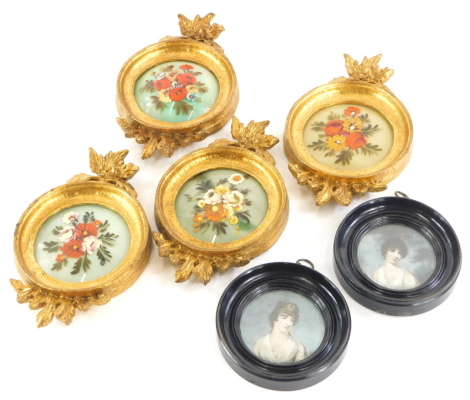 A set of four miniature glass paintings, each decorated with flowers in gilt frames, and a pair of late miniature prints, each in ebonised frames. (6)