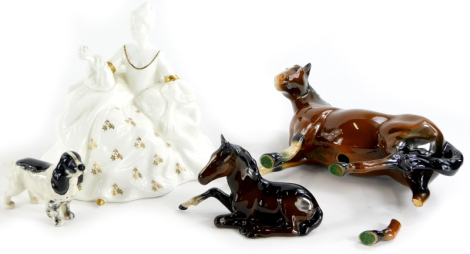 A Beswick black and white Spaniel, a Beswick type horse, (AF), a foal and a Royal Doulton figurine Antoinette HN2326.