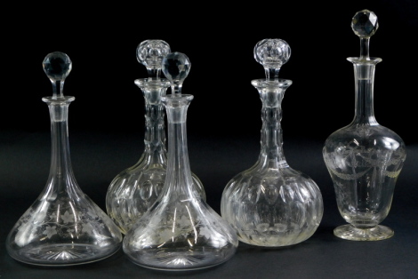 A pair of 19thC cut glass bottle shaped decanters and stoppers, a pair of mallet shaped decanters and stoppers, each decorated with ivy, and another. (5)