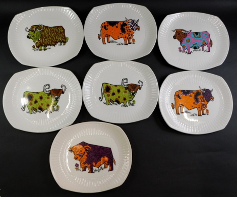 A set of seven Beefeater steak and grill plates, each with a vintage design of a coloured cow.