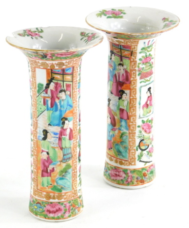 A pair of 19thC Chinese Canton porcelain cylindrical vases, each with a flared rim, 22.5cm high. (AF)