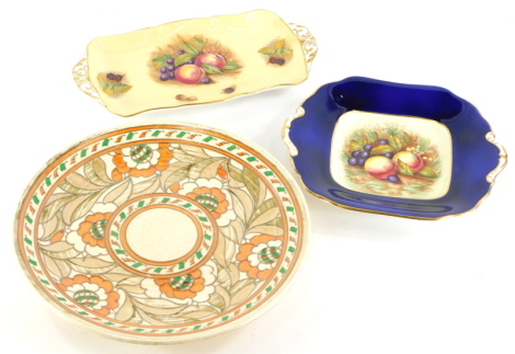 A Crown Ducal Charlotte Rhead designed plate or charger, an Aynsley rectangular square plate with two handles, and another similar. (3)