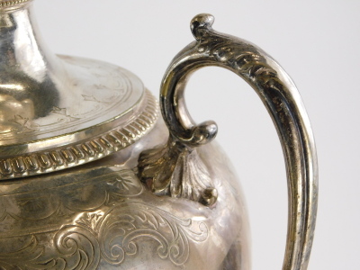 A late 19th/early 20thC silver plated two handled samovar, engraved with scrolls, surrounding a vacant cartouche, with part fluted body, complete with burner section (wedged), on a square foot with bun feet, 59cm high. - 4