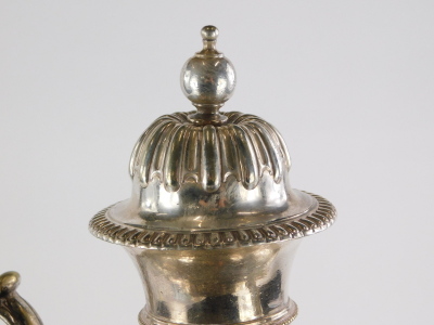 A late 19th/early 20thC silver plated two handled samovar, engraved with scrolls, surrounding a vacant cartouche, with part fluted body, complete with burner section (wedged), on a square foot with bun feet, 59cm high. - 5