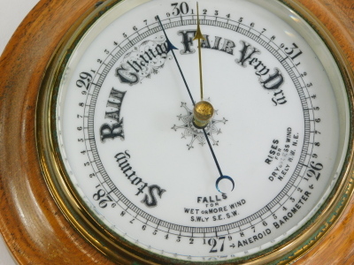 An early 20thC circular aneroid barometer, in an oak case, 20cm diameter. - 2