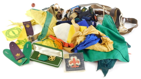 A quantity of Boy Scout and Girl Guide memorabilia, to include badges, belts, etc.