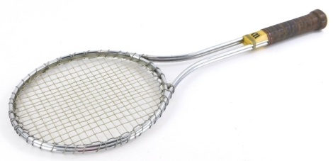 A Wilson T2000 metal racket, with leather bound handle, the same type of racket favoured by Jimmy Connors, 67.5cm long.