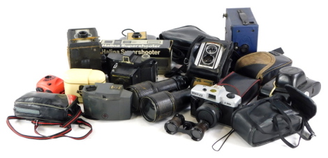 A quantity of cameras, to include Halina, Ronilflex, binoculars, etc.