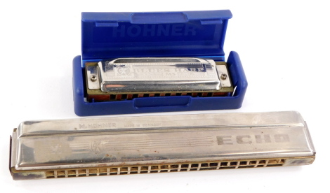 A Hohner Blues harp, stamped MS with fitted case and a Hohner Echo Harmonica. (2)