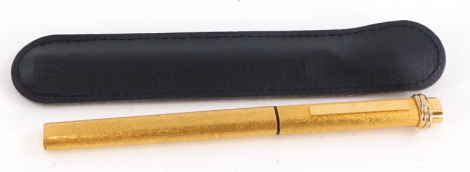 A Cartier gold plated fountain pen, with textured finish, etc.