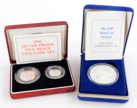 Three silver coins, a 1990 silver proof 50p, 5p two coin set, and a fifty dollar Battle of Britain commemorative proof coin. (3)