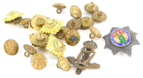 A collection of military and other badges, to include a silver badge for the Royal Masonic Institution for Girls 1919, and various gilt metal buttons.