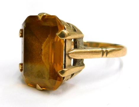 A 9ct gold dress ring, with rectangular citrine stone, in a six claw setting, on a raised shank, with etched shoulders, ring size T½, 6g all in.