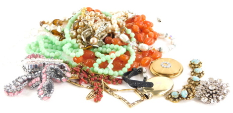 A group of costume jewellery and effects, to include an orange hard stone necklace, various dress necklaces, compact, Eastern style chains, etc. (1 box)