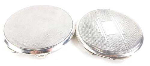 An Art Deco circular engine turned silver compact, incomplete and a silver compact. (2)