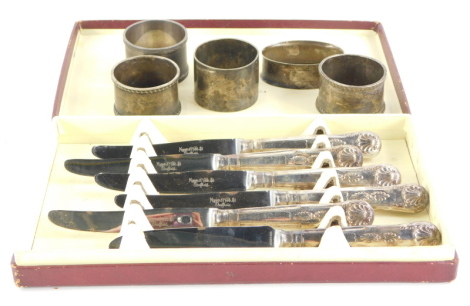 A collection of silver and silver plate, to include three various silver napkin rings, 3½oz, two silver plated napkin rings, and a set of six dessert knives in Mappin and Webb box, a set of six George V dessert knives and forks, each with a silver blade a