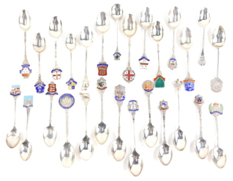 A quantity of silver and enamel souvenir spoons, all bearing hallmarks, 11¾oz gross.