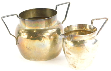 A Victorian silver two handled sugar bowl and a milk jug, London 1890, 2¾oz.