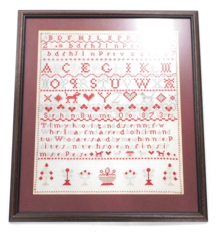 A Victorian wool work sampler, stitched in red, grey etc., Sarah Ann Brummitt, 30th November 1887, aged 13 years, 46cm x 40cm.