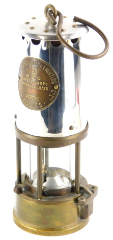 A Protector miner's lamp type 6, in polished steel and brass, 23cm high.