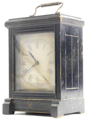 A Victorian Aesthetic movement carriage clock, with an ebonised case, the silvered dial decorated with Roman numerals, brass movement, 21cm high.