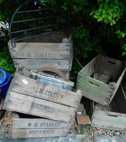 A collection of fruit crates, various makers with stenciled marks for W.R. Starkey Southwell and a metal hay rack.