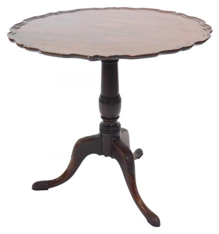 A 19thC mahogany occasional table, the circular dished top with a piecrust border, on a turned column and leaf carved tripod base, adapted, 62cm high, 76cm diameter.