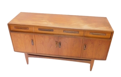 A G-Plan teak sideboard, with three frieze drawers above four doors, on tapering legs, 75cm high, 151cm wide, 45cm deep. - 2