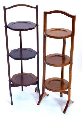 Two early 20thC mahogany folding cake stands, each on end supports.