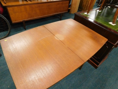 A 1960s/70s retro teak rectangular extending dining table, the top 82cm x 119cm, and four chairs. The upholstery in this lot does not comply with the 1988 (Fire & Fire Furnishing) Regulations, unless sold to a known exporter or upholsterer it will be cut - 2