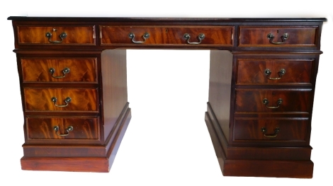 A mahogany pedestal desk, the top with a green leather inset and a moulded edge above nine drawers on plinth base, 82cm high, 153cm wide, 89cm deep. Note: VAT is payable on the hammer price of this lot at 20%.