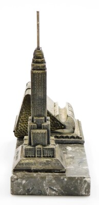 An Art Deco cigarette dispensing desk stand, formed with a cast spelter model of the Empire State Building New York on a black marble base, 19cm high, 22cm wide. - 2